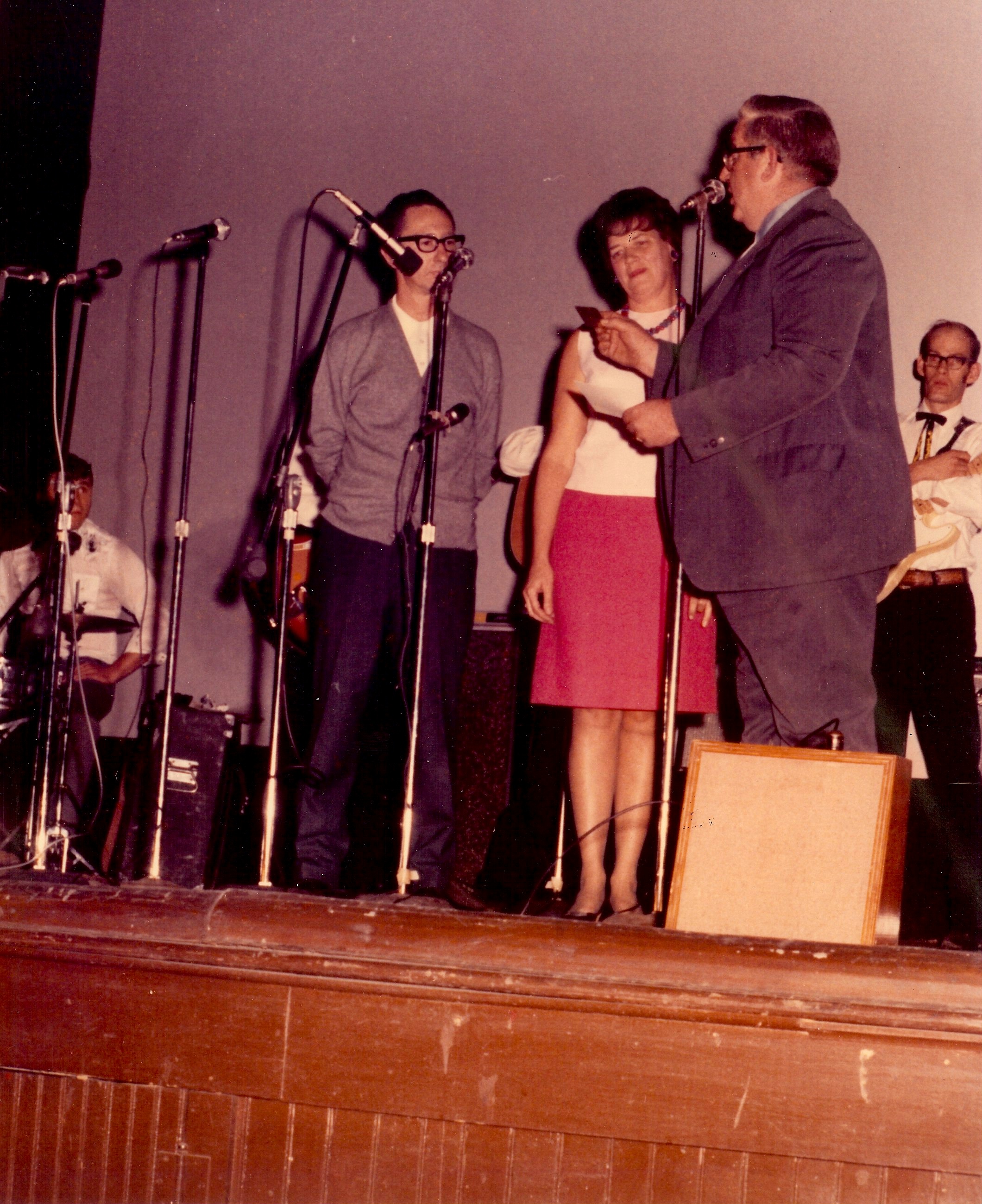 Onstage at the Keystone Theatre, the Buffington's receive an appreciation award from a representative of the Penn York Country Music Club, circa 1970