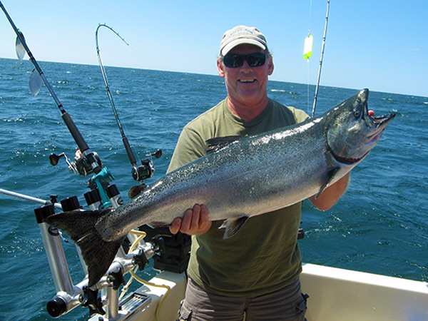 Henderson Harbor Fishing with Milky Way Charters - Matt Clark Displaying Nice Summer King!