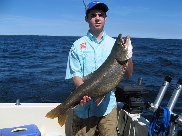 Henderson Harbor Fishing with Milky Way Charters - Bailey Holding Lunker Lake Trout!
