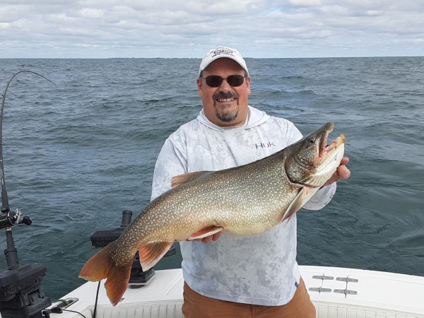 Tom Showing Off His 23 lb. Lake Trout!