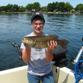 Henderson Harbor Fishing with Milky Way Charters - Dalton Showing Off His Lunker Bass!