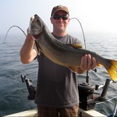 Henderson Harbor Fishing with Milky Way Charters - Tom with lunker Laker!