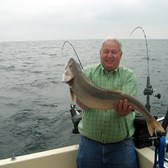 Henderson Harbor Fishing with Milky Way Charters - John displaying his lunker Laker!