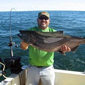 Henderson Harbor Fishing with Milky Way Charters - Larry with Big King!