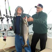 Henderson Harbor Fishing with Milky Way Charters - Bruce with son Aaron showing off his King!