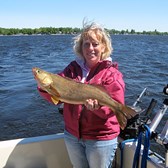 Henderson Harbor Fishing with Milky Way Charters - Liz holding her Walleye!