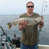 Henderson Harbor Fishing with Milky Way Charters - Kevin displaying his Lake Trout