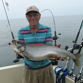Henderson Harbor Fishing with Milky Way Charters - Bob Zehr holding beauty Laker!