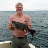 Henderson Harbor Fishing with Milky Way Charters - Bill With Lunker Bass!