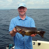 Henderson Harbor Fishing with Milky Way Charters - Jeff Holding Nice Bass!