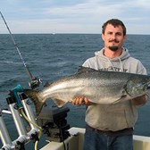 Henderson Harbor Fishing with Milky Way Charters - Brent Showing Off His King Salmon!