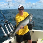 Henderson Harbor Fishing with Milky Way Charters - Matt Displaying a Laker!