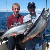 Henderson Harbor Fishing with Milky Way Charters - Paul and Son, Andrew, Showing off Their Kings!