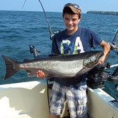 Henderson Harbor Fishing with Milky Way Charters - Chris Showing Off His Trophy King Salmon!