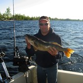 Henderson Harbor Fishing with Milky Way Charters - Tim Suiter party with another great catch