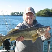 Henderson Harbor Fishing with Milky Way Charters - The Captain's beautiful wife, Cindy, with a trophy Walleye!