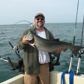 Henderson Harbor Fishing with Milky Way Charters -Good friend Rick Welsh with a King