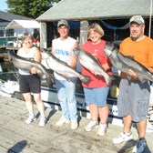 Henderson Harbor Fishing with Milky Way Charters - Happy customers by the Milky Way!
