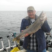Henderson Harbor Fishing with Milky Way Charters - Tim Nortz Holding Nice Laker