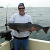 Henderson Harbor Fishing with Milky Way Charters - John holding onto another King!