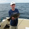 Henderson Harbor Fishing with Milky Way Charters - Evan Showing Off His Big Bass!